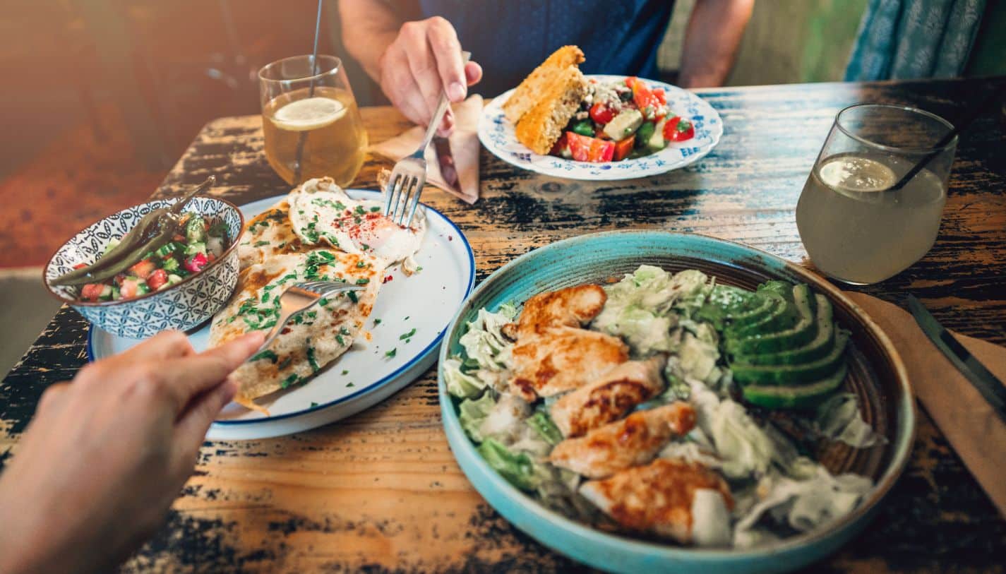 View of the table of food of a couple eating out