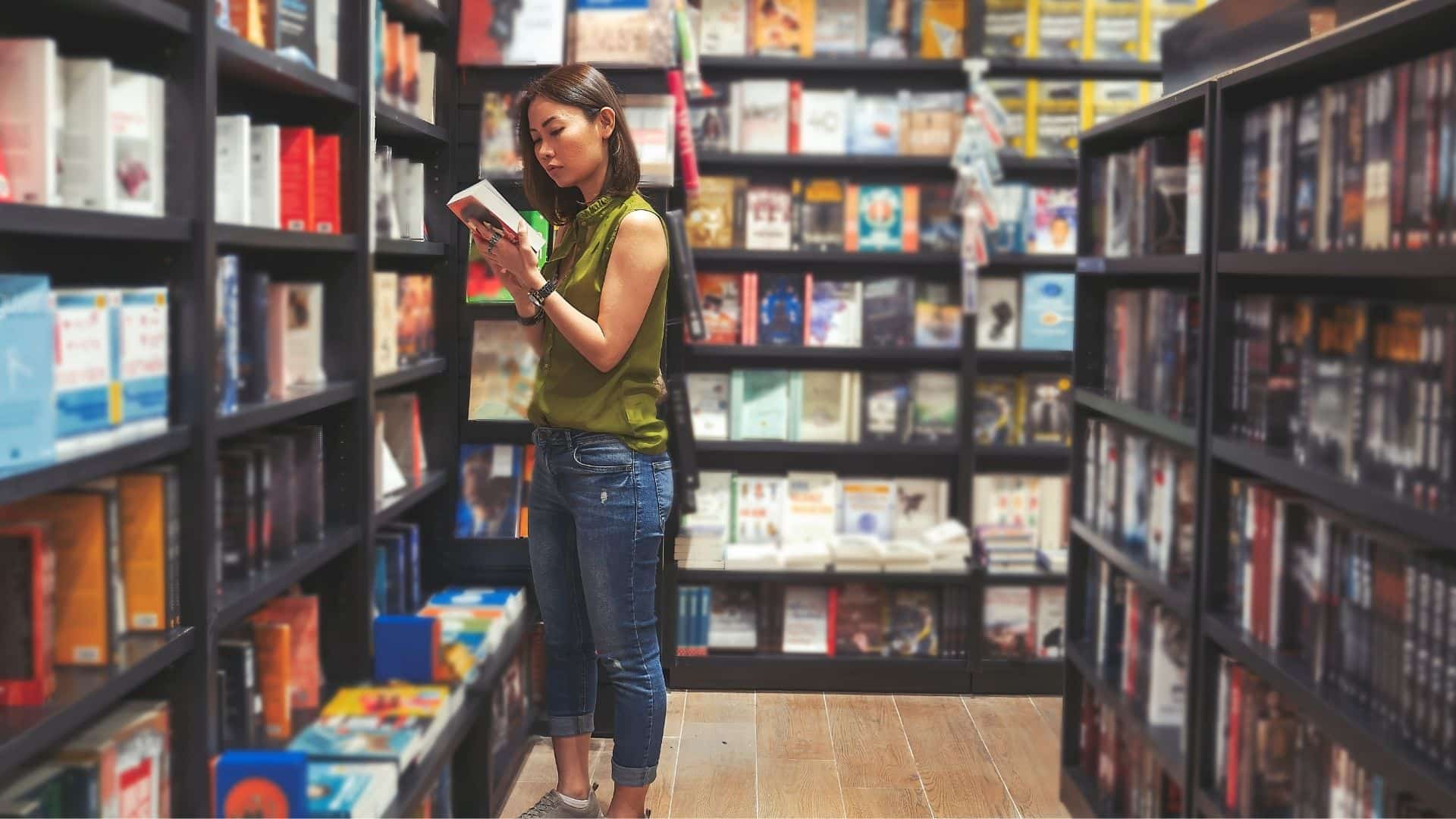 woman shopping for books at a bookstore