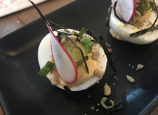 Deviled eggs with radish, spring onions, and sunflower seeds from Bird and the Bottle in Santa Rosa, CA; Wine Country, Napa Valley, fine dining