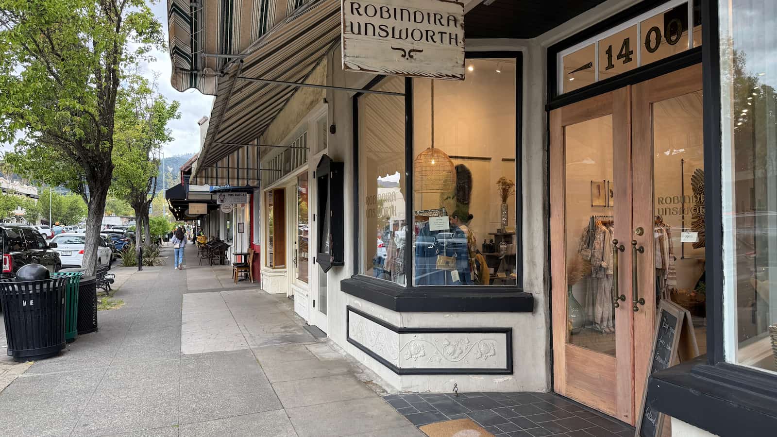 A storefront in Calistoga with a sign reading "antique shop" displayed prominently above the entrance.
