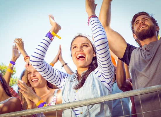 Excited music fans up the front at a music festival