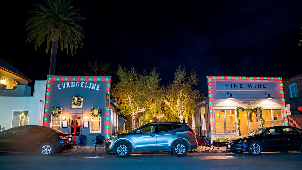 Evangeline and Olabasi, two Calistoga restaurants, decorated in red and green Christmas lights.