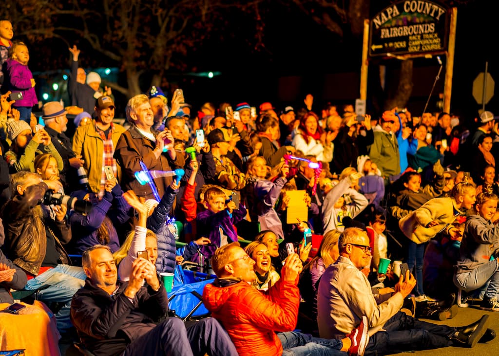A crowd of visitors watching the Calistoga lighted tractor parade.