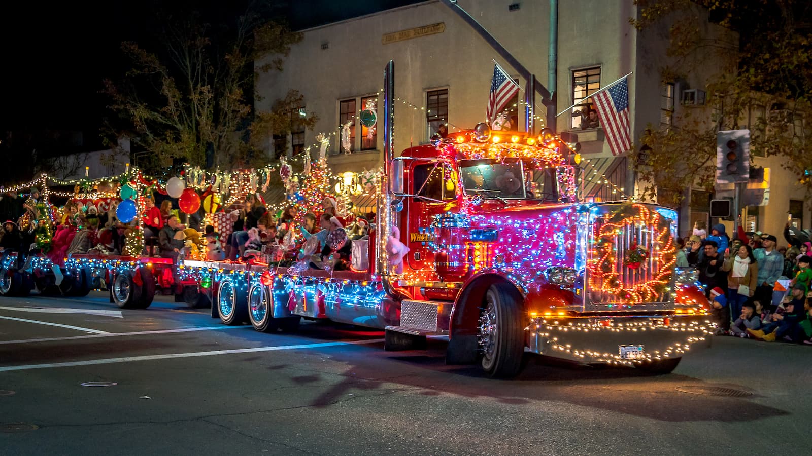 A large semi-truck decorated in Christmas lights for the Calistoga Lighted Tractor Parade, a famous Napa Valley event.