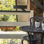 Close up view of metal patio chair and table on a balcony