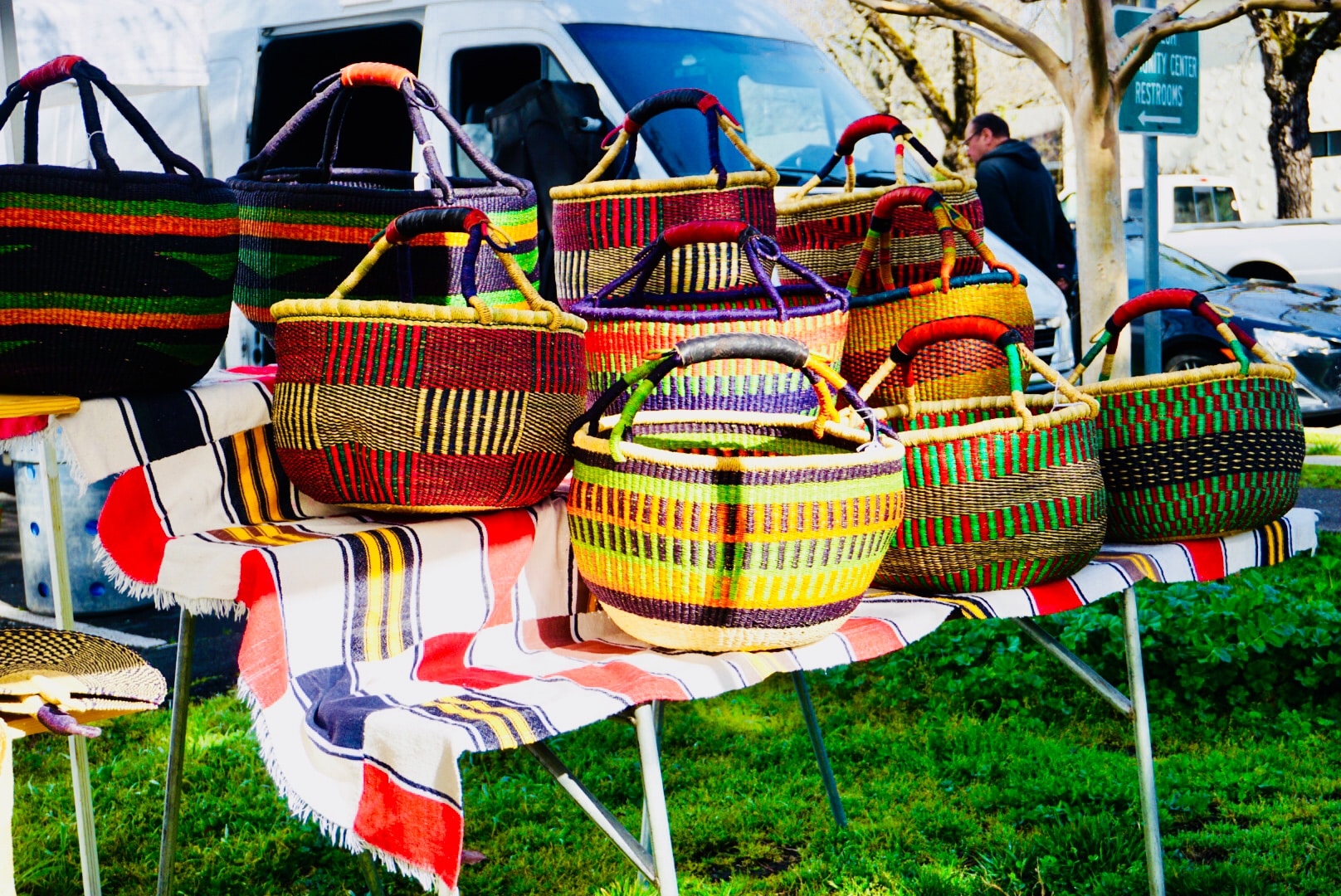 Woven colorful baskets for sale at the Calistoga Farmer's Market in the Napa Valley; Wine Country