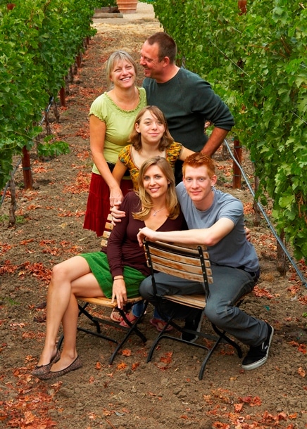 Family photo of owner's family in vineyard