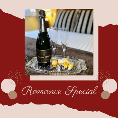 Romance Special with Champagne and chocolates served on glass tray on bed