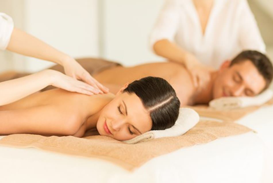 Woman and man getting massages