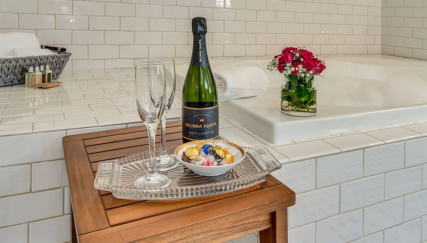 Soaking tub with a bottle of wine, chocolates and flowers for a romantic treip to Calistoga